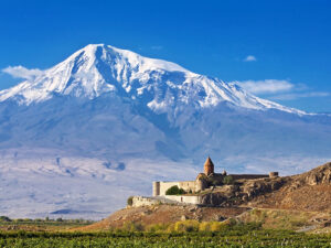 Ancient monastery on a background of mountains and grape fields